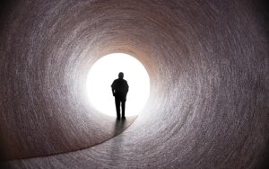 Emerging,From,A,Dark,Tunnel,,A,Man,Walks,Towards,A